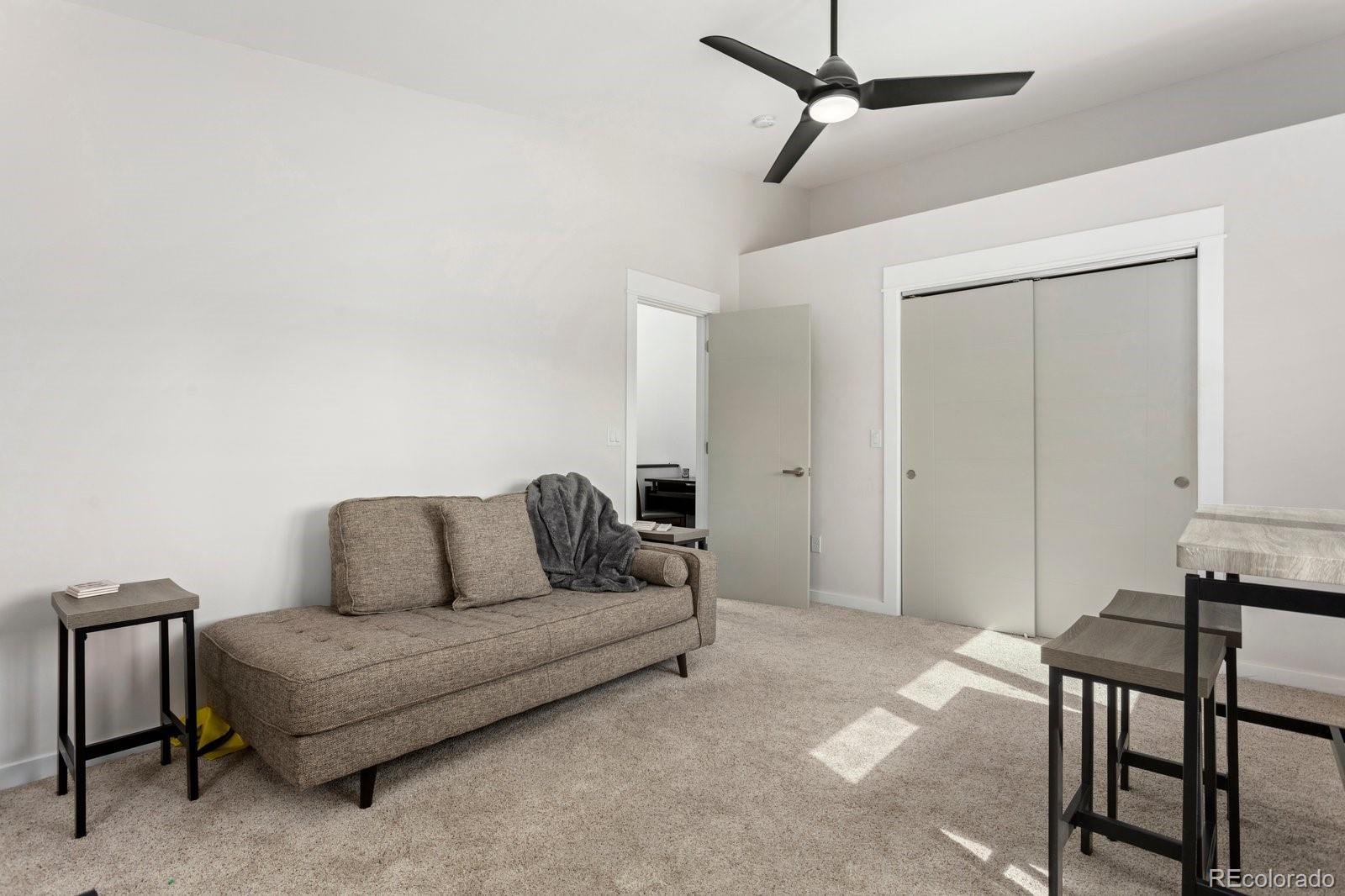 1036 H Street Salida, CO 81201 - Photo 49 of 50 a living room with furniture and a ceiling fan