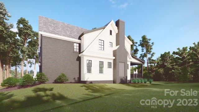 5515 Fairview Road Charlotte, NC 28209 - Photo 4 of 13 a view of a white house with a big yard and large trees