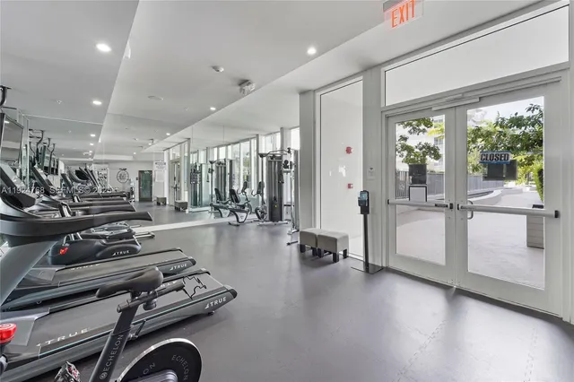 a kitchen with stainless steel appliances granite countertop a stove and a refrigerator