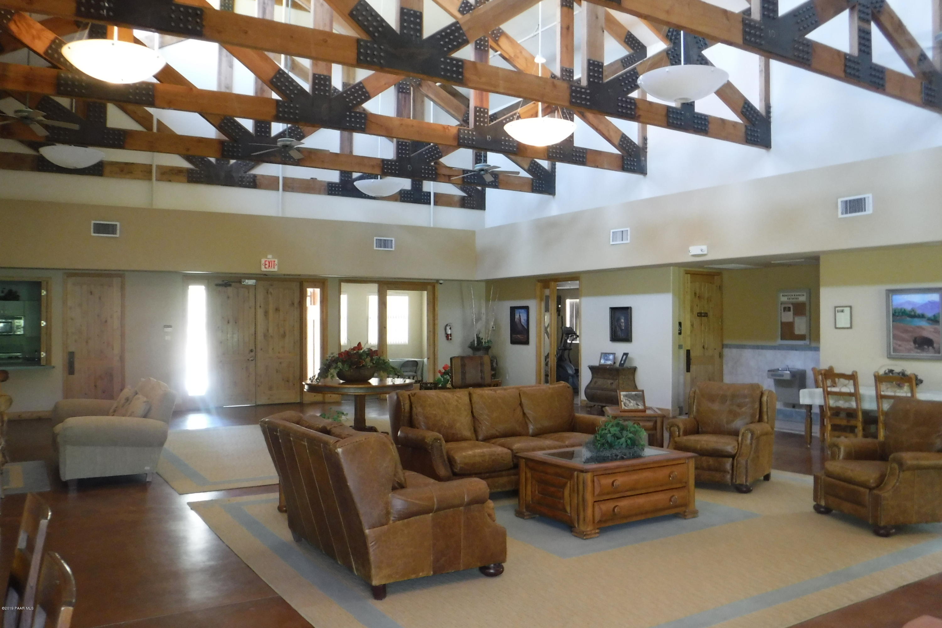 15265 East Countryside Road Mayer, AZ 86333 - Photo 10 of 12 a living room with furniture and a chandelier