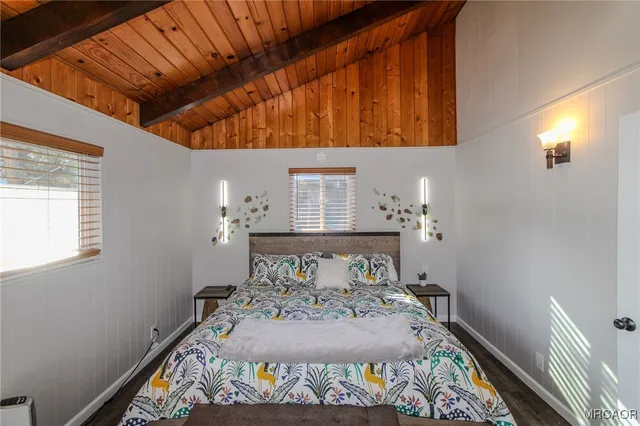 a bed sitting in a bedroom next to a window