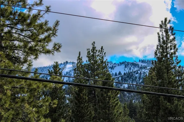 a view of a yard and mountain view