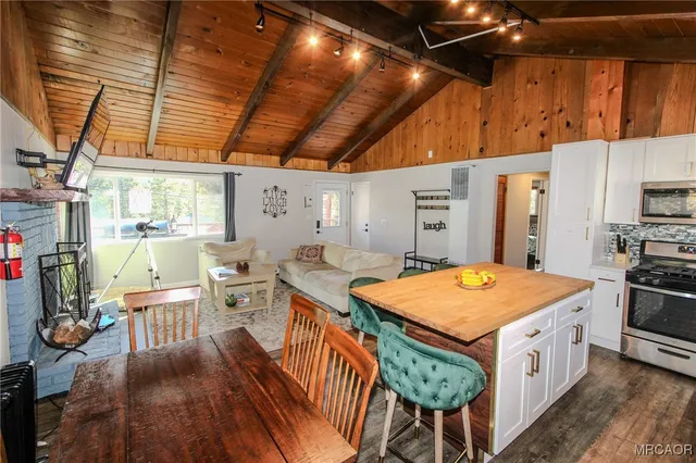 a kitchen that has a lot of cabinets in it