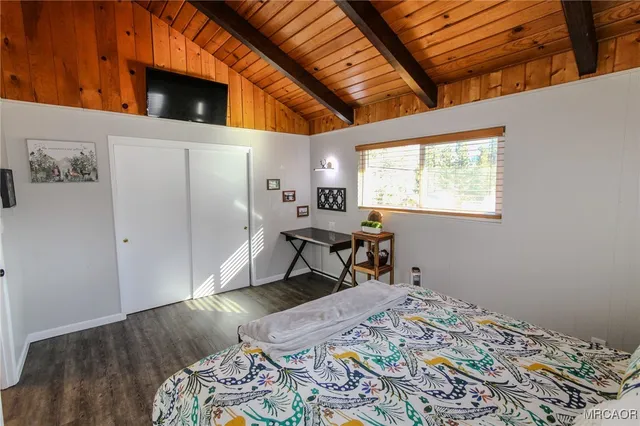 a bed room with a bed and a window