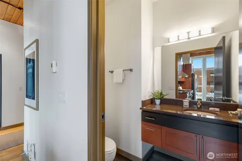 a bathroom with a double vanity sink and a mirror