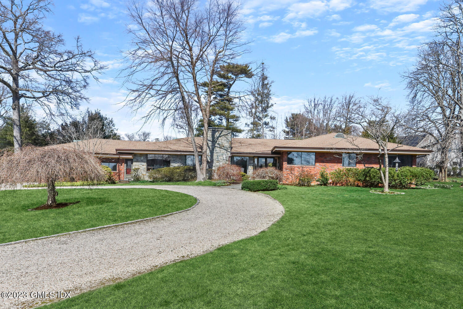 1 Seagate Road Riverside, CT 06878 - Photo 28 of 31 a view of a big yard with a house and a garden