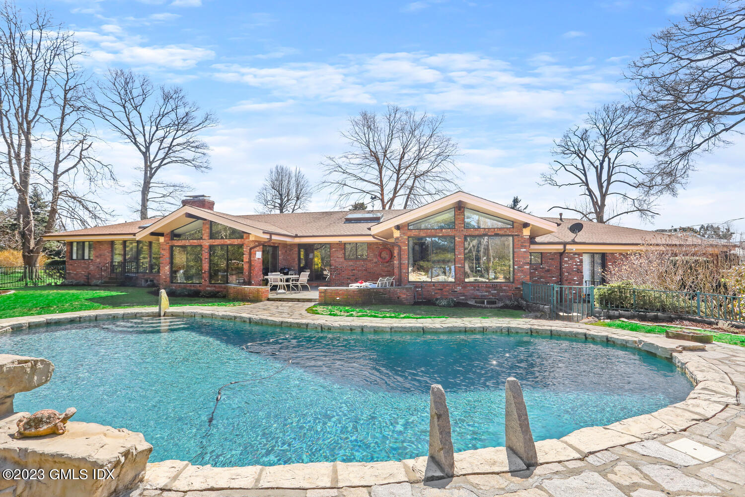 1 Seagate Road Riverside, CT 06878 - Photo 4 of 31 a front view of house with yard and green space