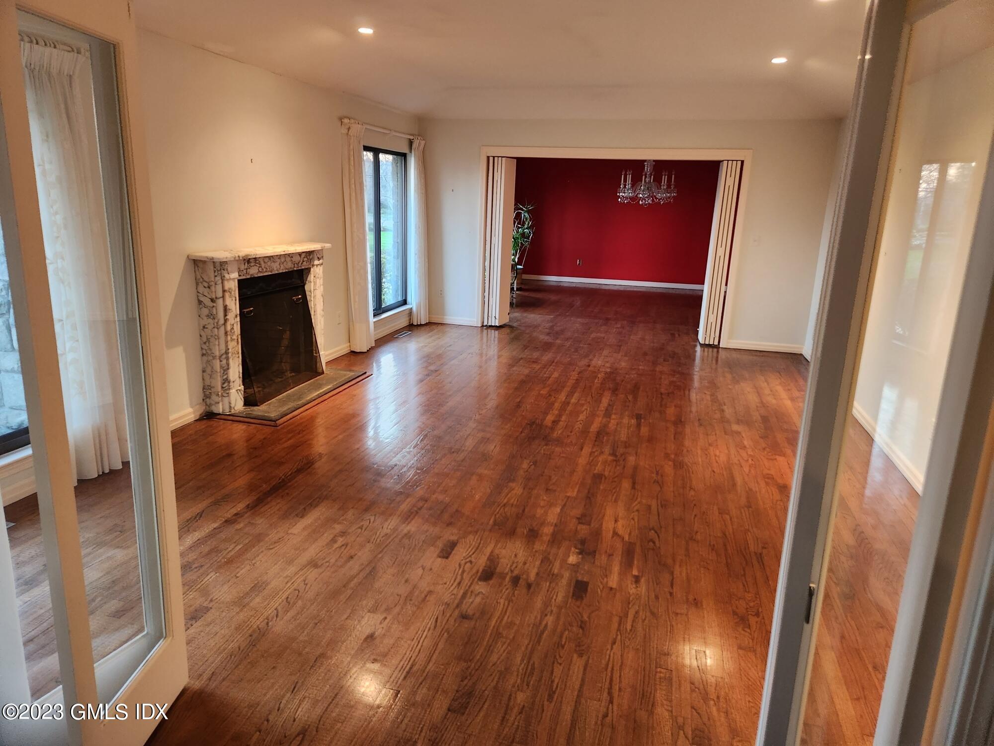 1 Seagate Road Riverside, CT 06878 - Photo 7 of 31 wooden floor in an empty room with a fireplace