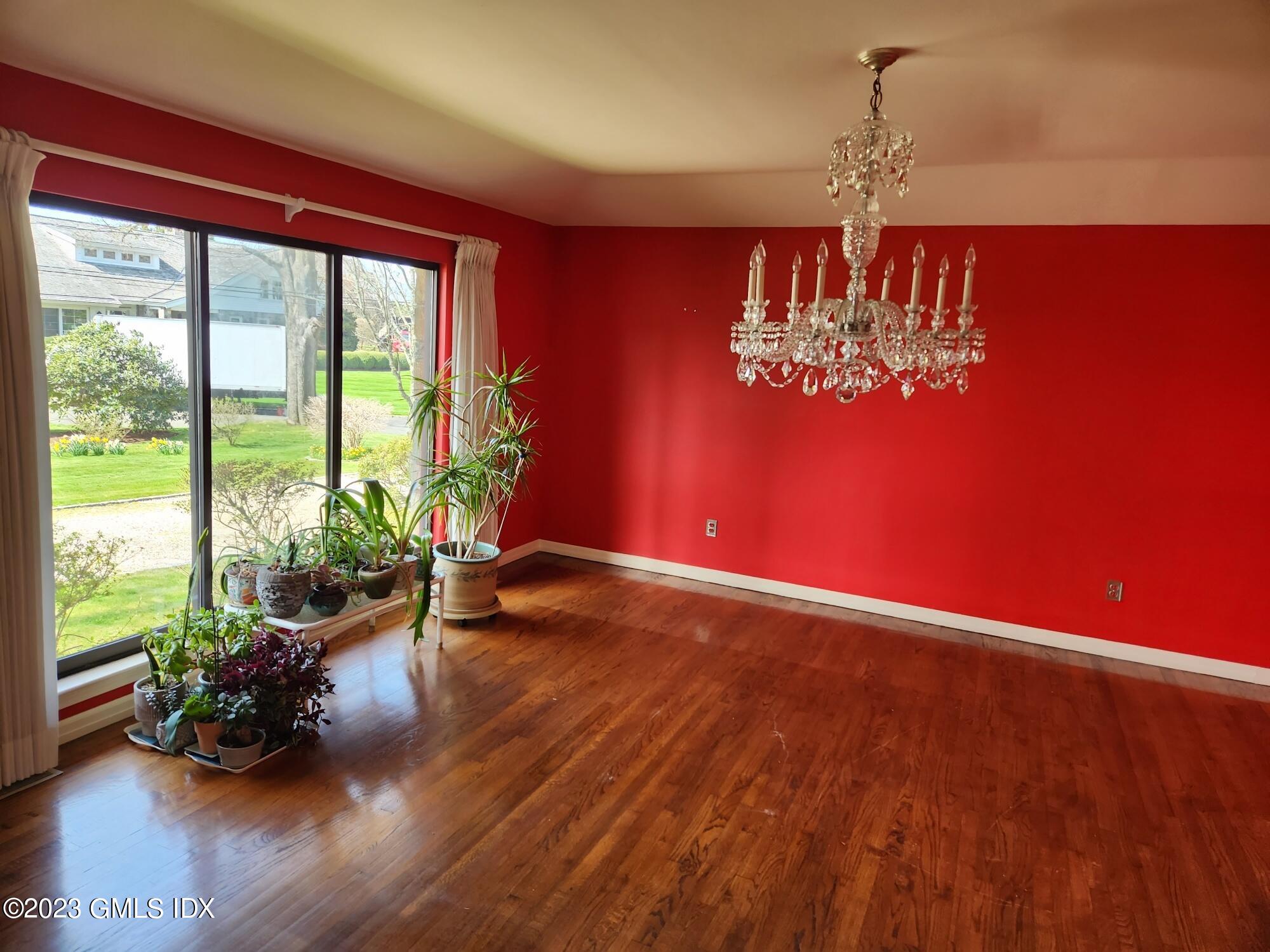 1 Seagate Road Riverside, CT 06878 - Photo 8 of 31 a view of a room with wooden floor lounge chair and a large window