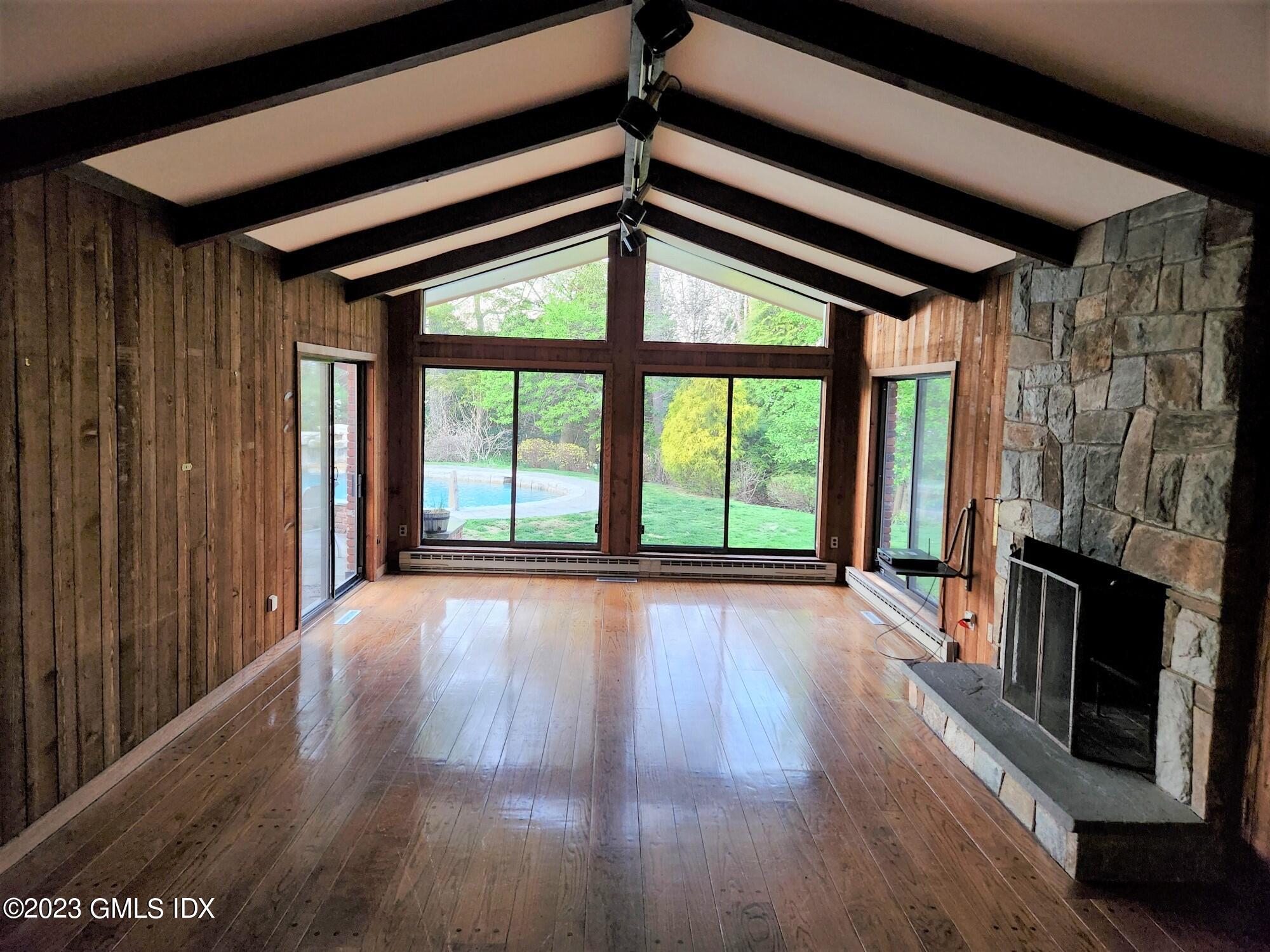 1 Seagate Road Riverside, CT 06878 - Photo 9 of 31 a view of an empty room with wooden floor and a window