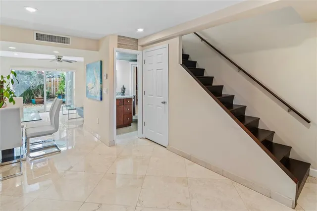a view of an entryway with wooden floor and windows