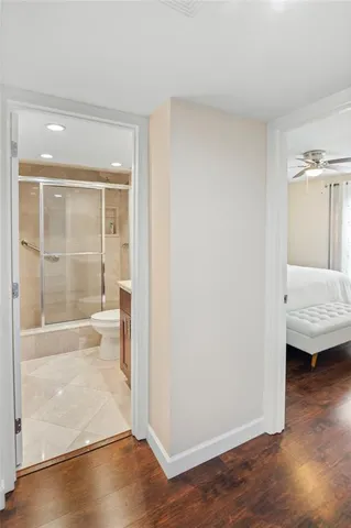 a bathroom with a glass shower door