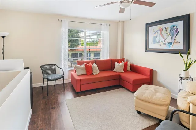 a living room with furniture and a window