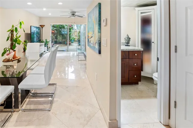 a view of entryway and hall with dining room