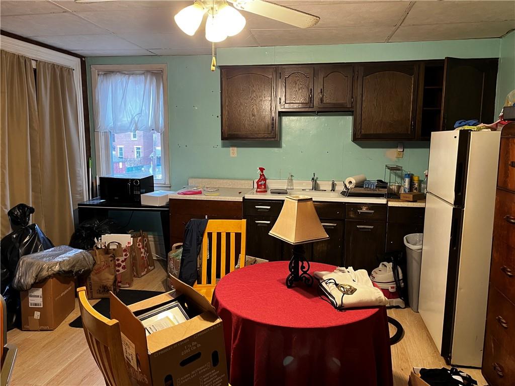 334 Main Street Pittsburgh, PA 15201 - Photo 16 of 24 a kitchen with a sink refrigerator and cabinets