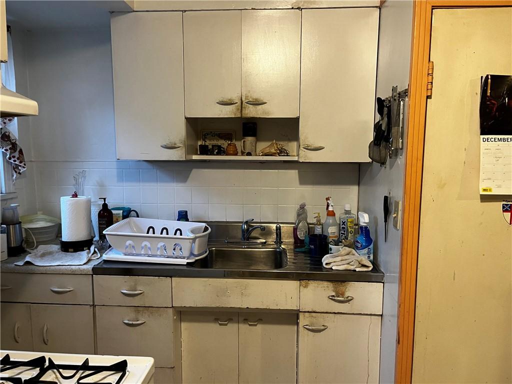334 Main Street Pittsburgh, PA 15201 - Photo 19 of 24 a kitchen with a stove and cabinets