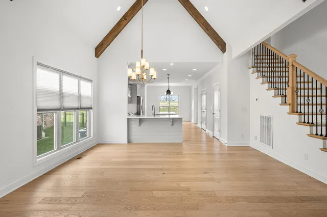 a view of an entryway with wooden floor