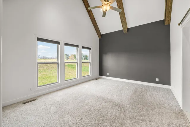a view of an empty room with stairs