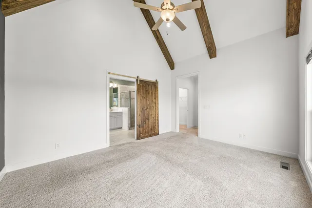 a bathroom with a double vanity sink mirror and bathtub