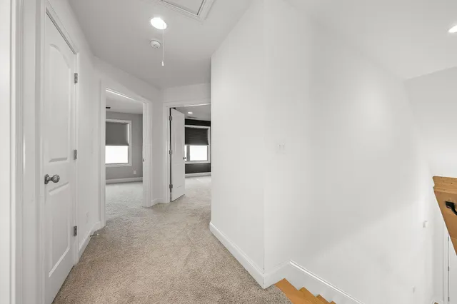 an empty room with fan and ceiling fan