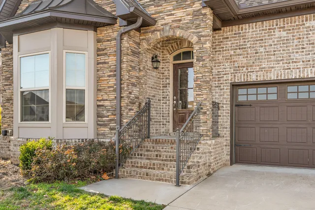 a front view of a house with a garage