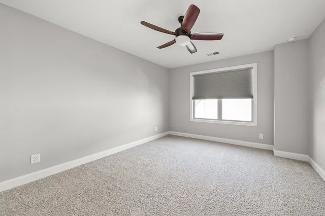 a view of a hallway with a bathroom