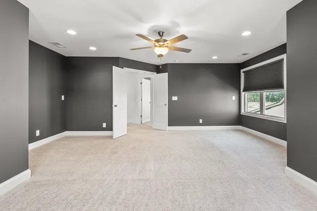 a view of a house with backyard porch and sitting area