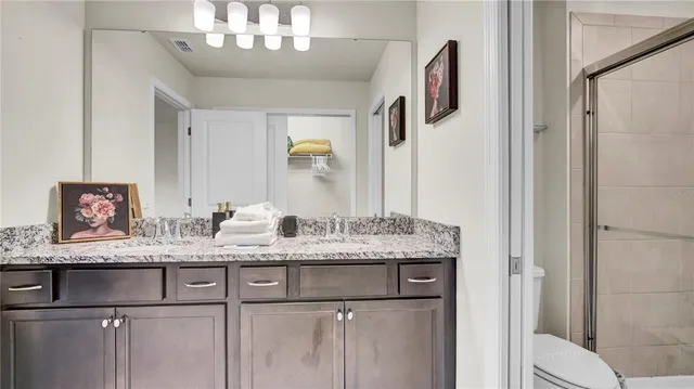 a large bed in a white room