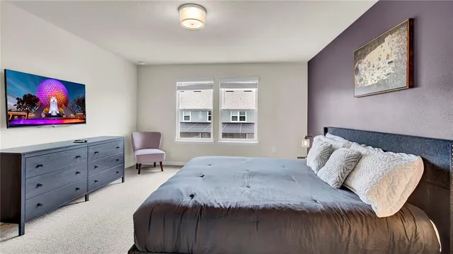 a bathroom with a granite countertop sink a mirror and shower