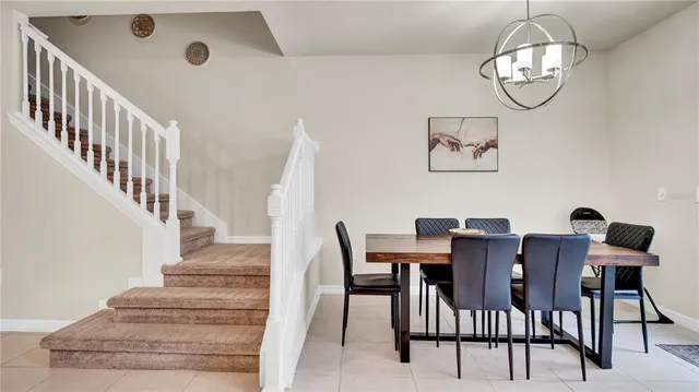 a kitchen with stainless steel appliances granite countertop a sink refrigerator and cabinets