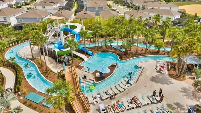 swimming pool view with a seating space
