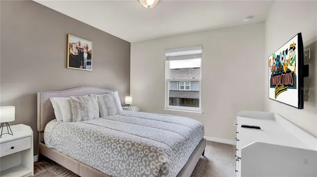 a room that has a bed and a table in it