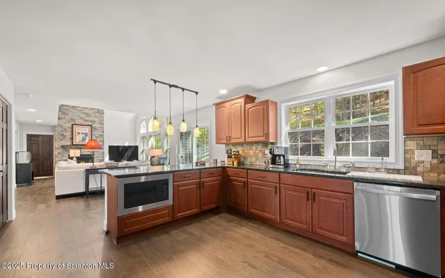 a kitchen with a sink stove and cabinets