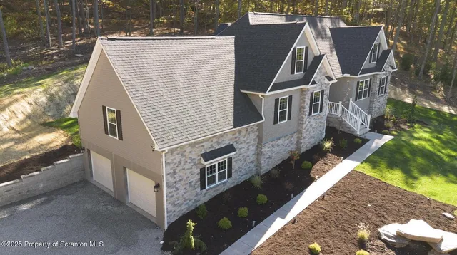 a aerial view of a house with a yard
