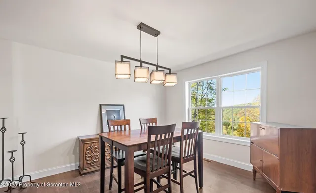 a utility room with multiple dryer and washer