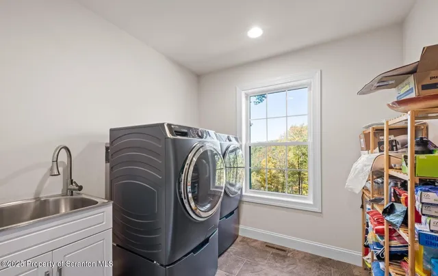 a living room with a bed furniture and a window