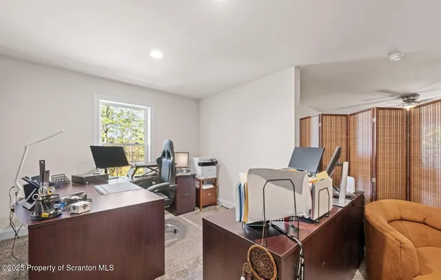 a view of walk in closet with clothes