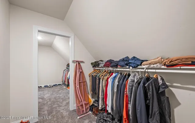 a bathroom with a granite countertop tub sink and mirror