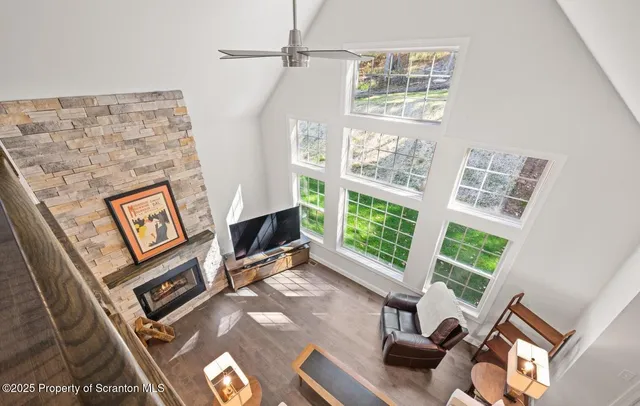 a view of staircase with railing and white walls
