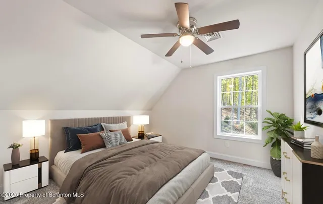 a bedroom with a bed and a dresser