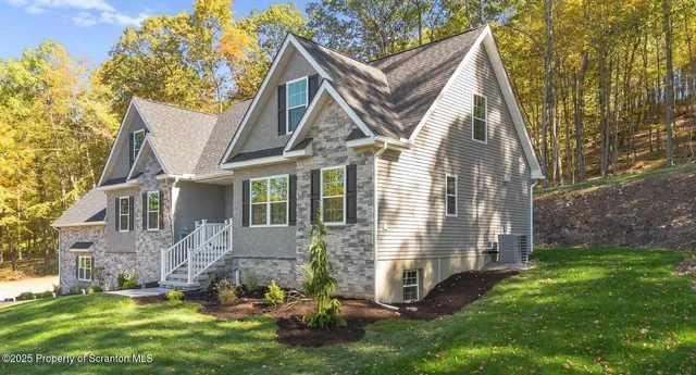 a view of a house with a yard