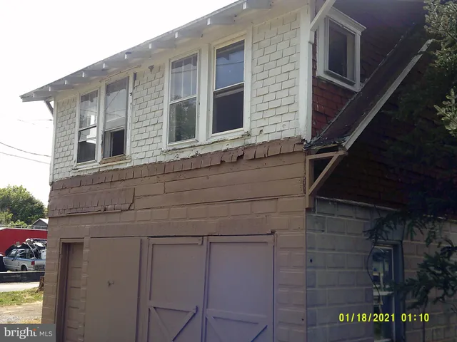 a front view of a house with garage