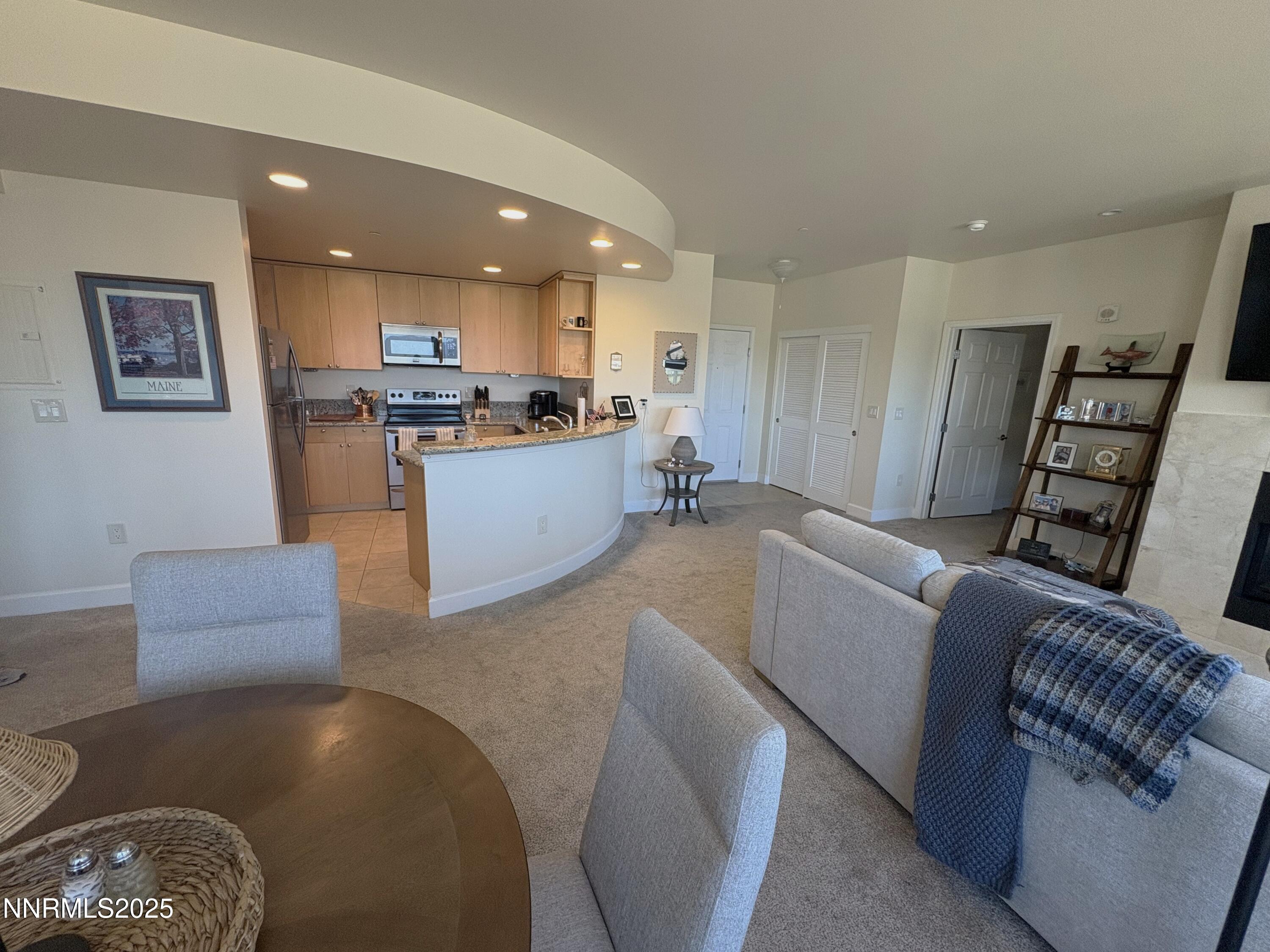 450 North Arlington Avenue, Unit 1207 Reno, NV 89503 - Photo 4 of 21 a living room with furniture and a wooden floor