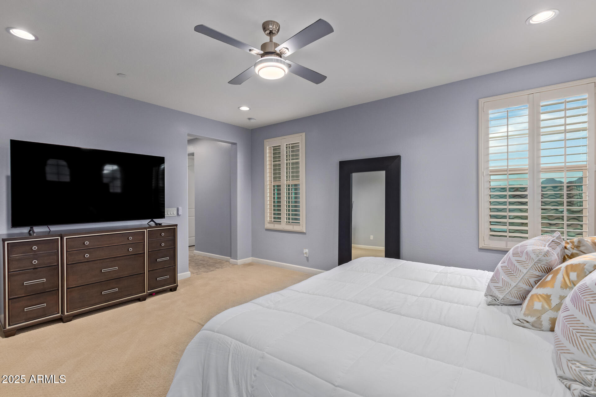 18557 North 94th Street Scottsdale, AZ 85255 - Photo 16 of 27 a bedroom with a bed and a flat screen tv