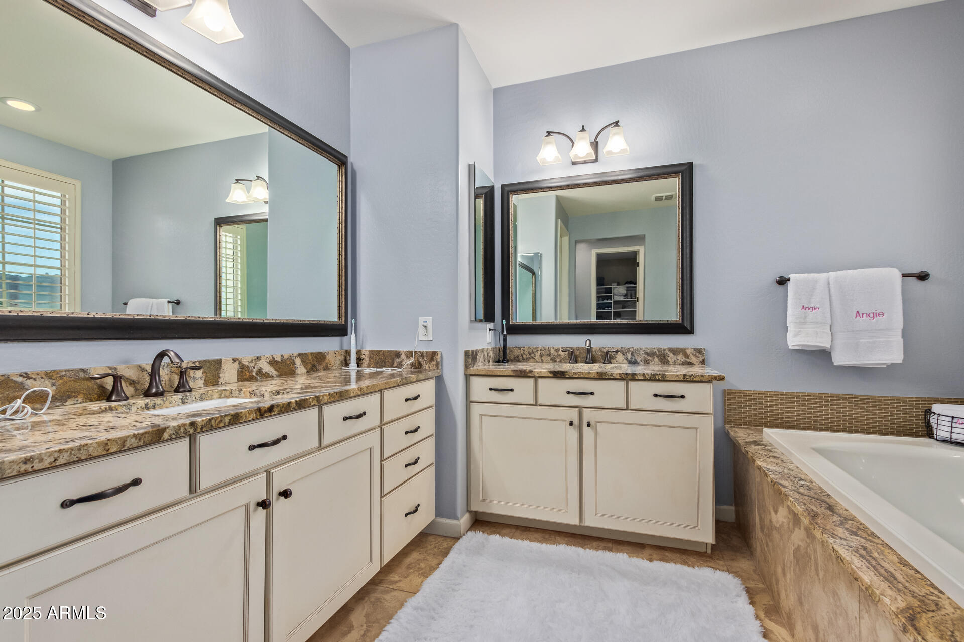 18557 North 94th Street Scottsdale, AZ 85255 - Photo 18 of 27 a bathroom with a sink and a mirror