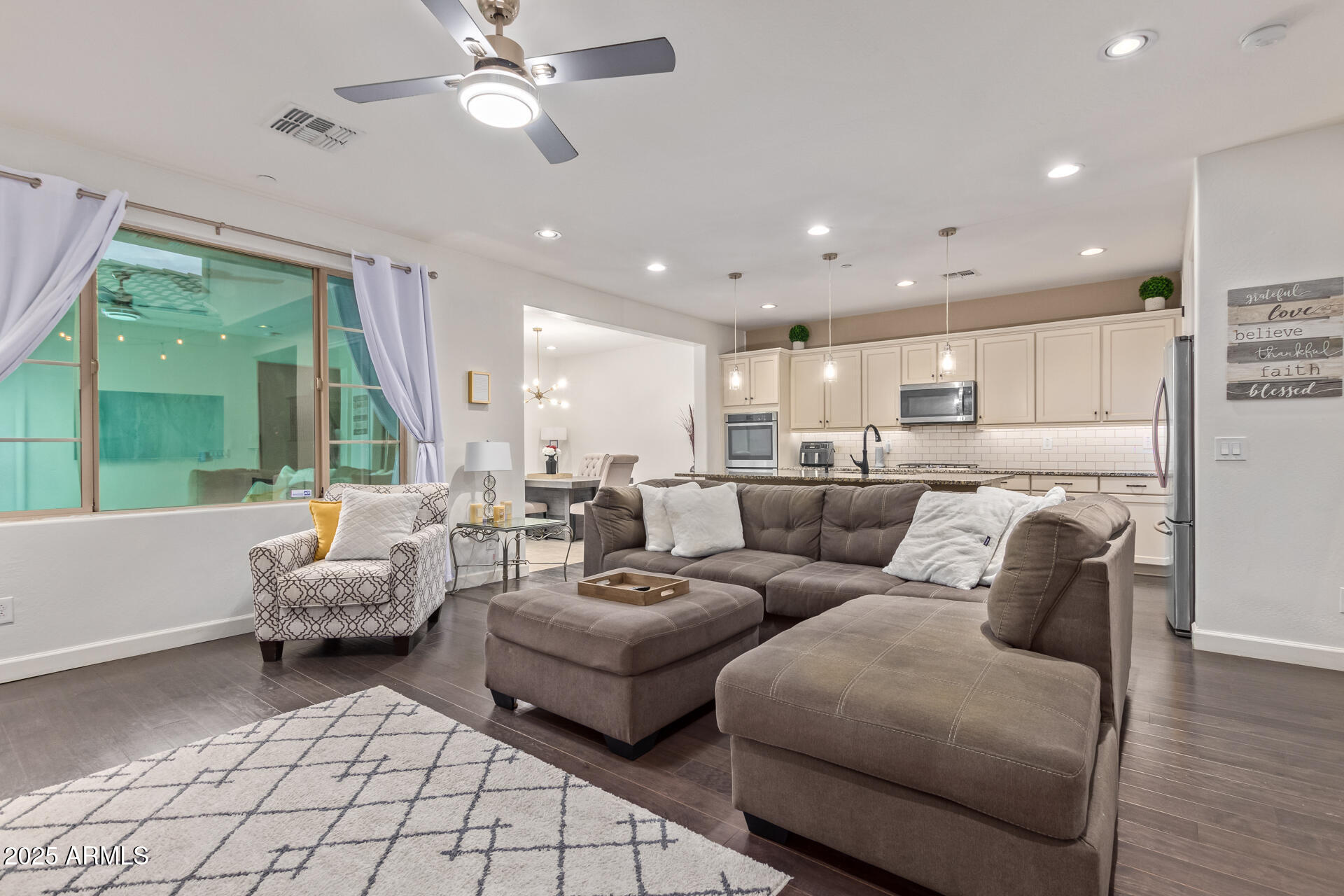 18557 North 94th Street Scottsdale, AZ 85255 - Photo 2 of 27 a living room with furniture and a large window