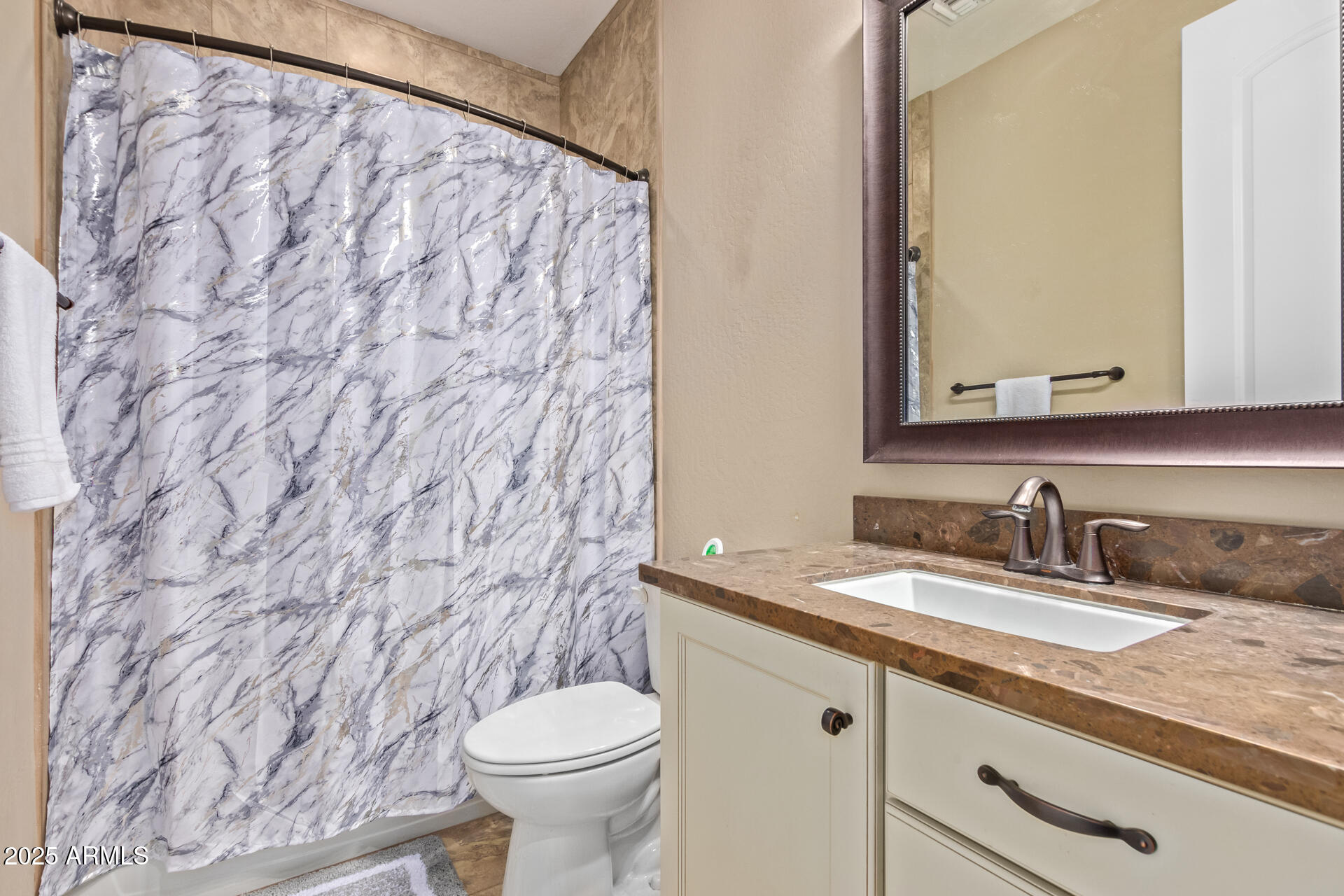 18557 North 94th Street Scottsdale, AZ 85255 - Photo 22 of 27 a bathroom with a granite countertop sink and a toilet