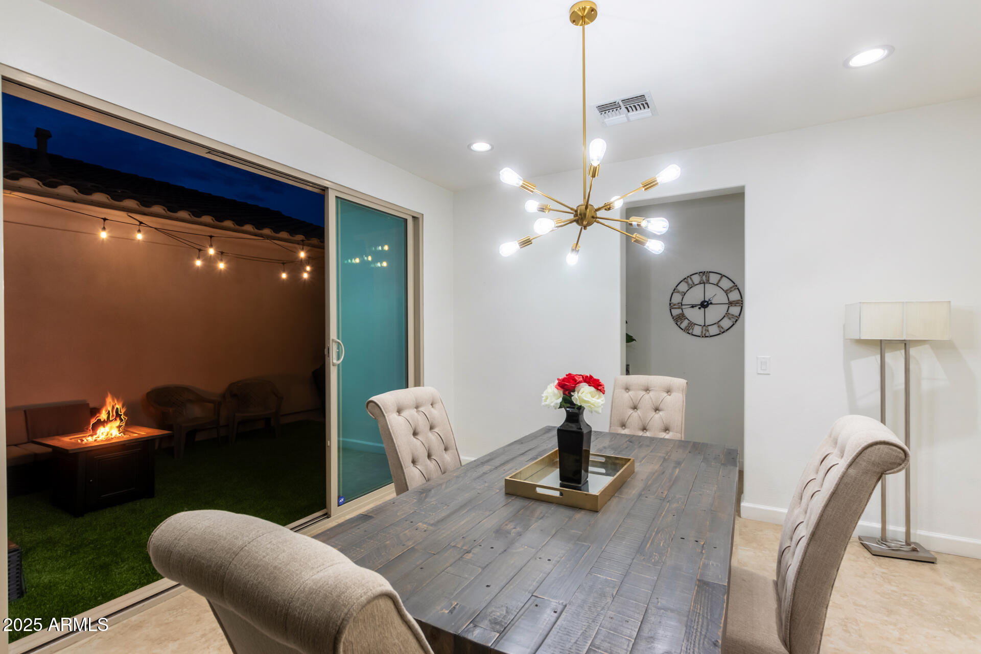 18557 North 94th Street Scottsdale, AZ 85255 - Photo 9 of 27 a living room with furniture and a chandelier