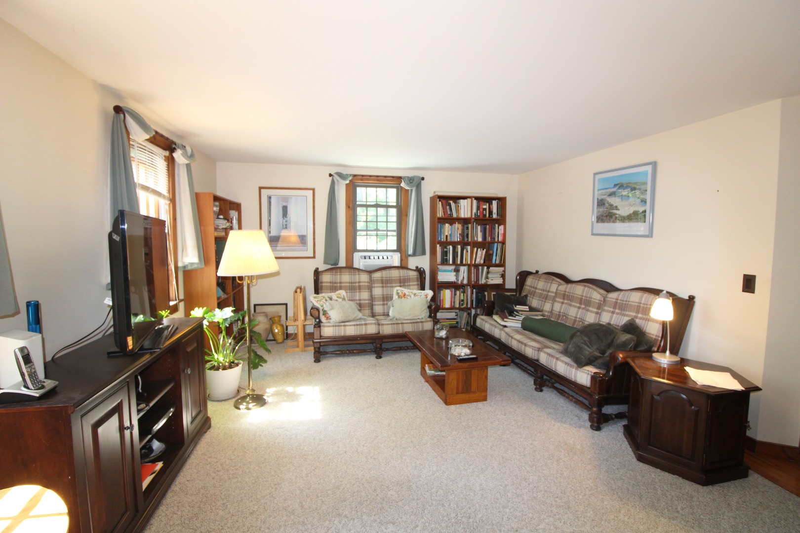 19 Vickers Street Edgartown, MA 02539 - Photo 3 of 16 a living room with furniture and a flat screen tv