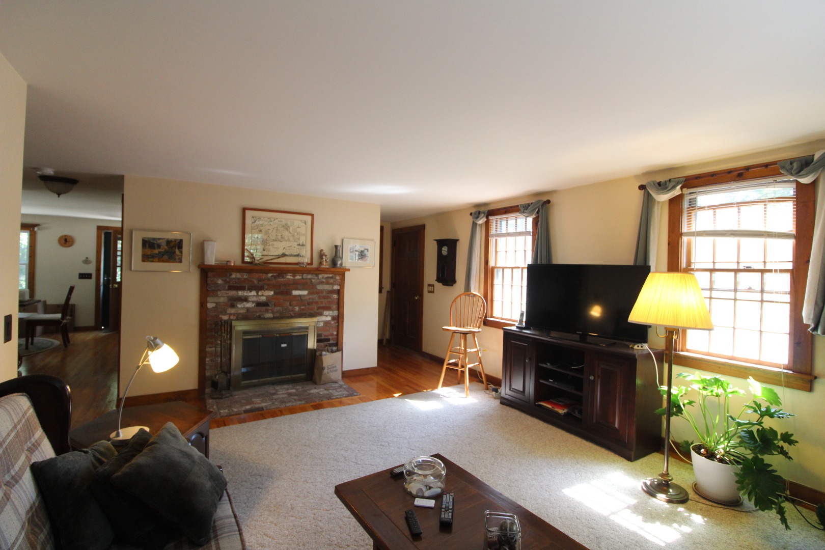 19 Vickers Street Edgartown, MA 02539 - Photo 4 of 16 a living room with furniture a fireplace and a flat screen tv